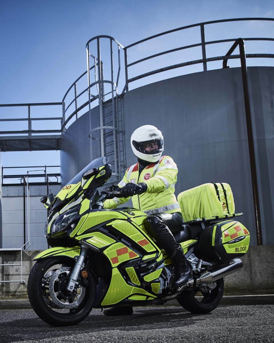 A man on a blood bike wearing protective equipment